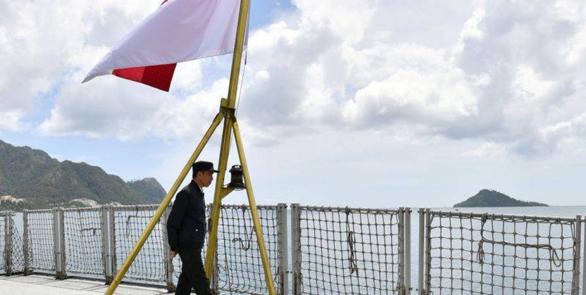 FILE PHOTO: Indonesia Presidents Joko Widodo walks next to a national flag during his visit at a military base in Natuna, near South China Sea, Indonesia January 8, 2020, Laily Rachev/Courtesy of Indonesian Presidential Palace/Handout via REUTERS/File Photo